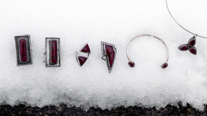Features entire collection of bloody bison jewelry on the snow